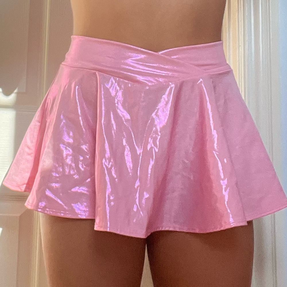 pink holographic cross over mini skirt in a size medium